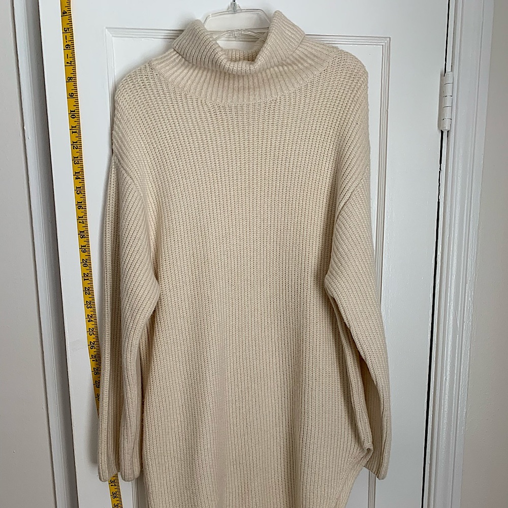 Cream turtleneck dress with slide slit